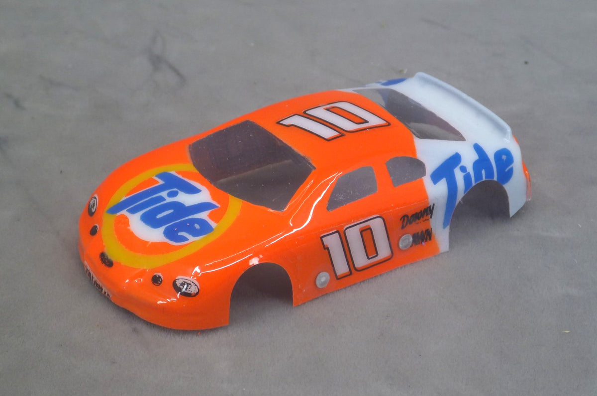 Front three-quarter view of orange and white Tide number 10 painted Lexan NASCAR HO slot car body with blue Tide lettering