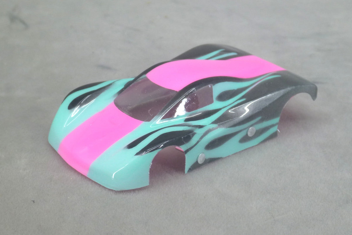 Front three-quarter view of Shadow Flame painted Lexan HO slot car body with fuchsia pink center stripe, light blue panels and black flames