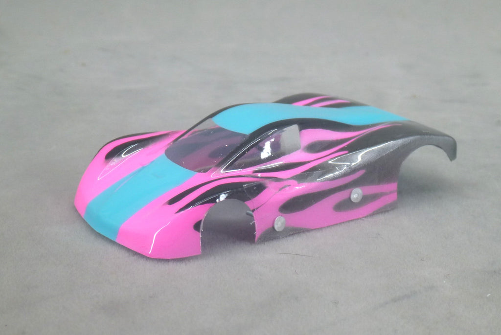 Front three-quarter view of blue and fuchsia Shadow Flame painted Lexan HO slot car body with black flame graphics
