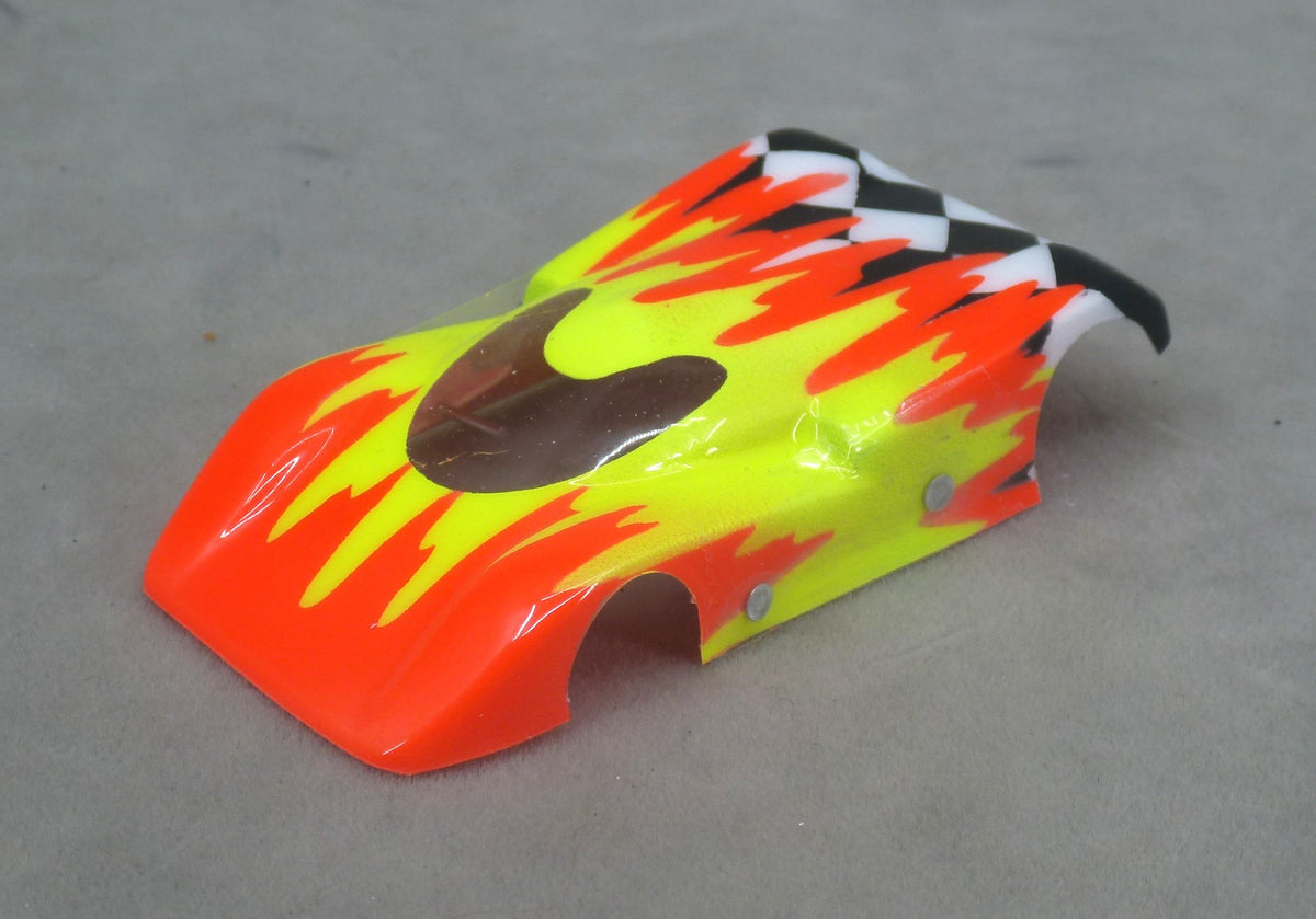 Front three-quarter view of orange and yellow Checkered Surge painted Lexan HO slot car body with checkerboard tail
