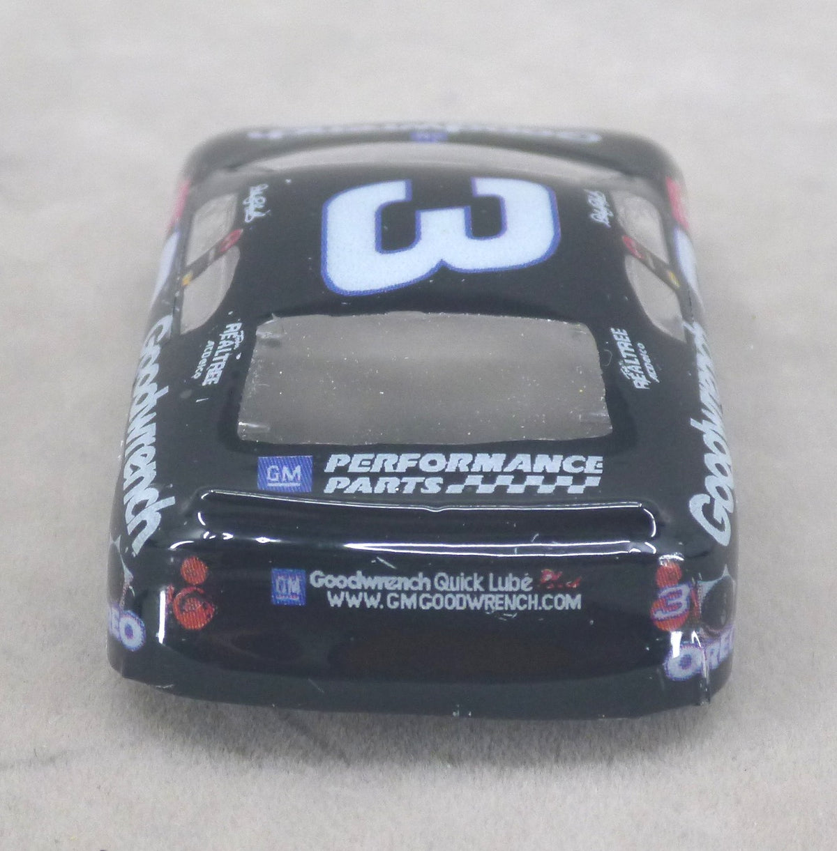 Rear view of black Oreo #3 painted Lexan HO slot car body with spoiler and GM Performance Parts graphics