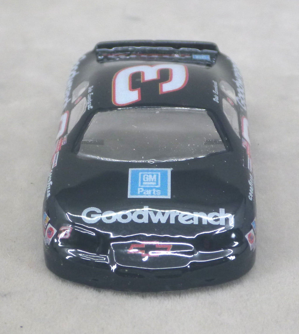 A black lexan model race car with 'Goodwrench' and a GM Parts logo on the hood, featuring the number 3 on the roof.