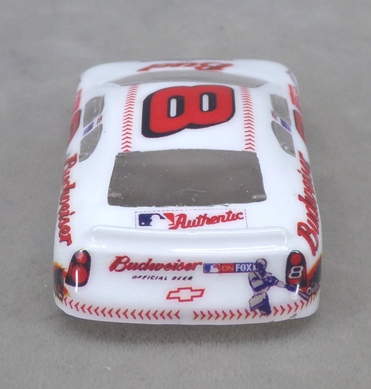 Rear view of white Budweiser #8 painted Lexan HO slot car body with Budweiser graphics and white spoiler