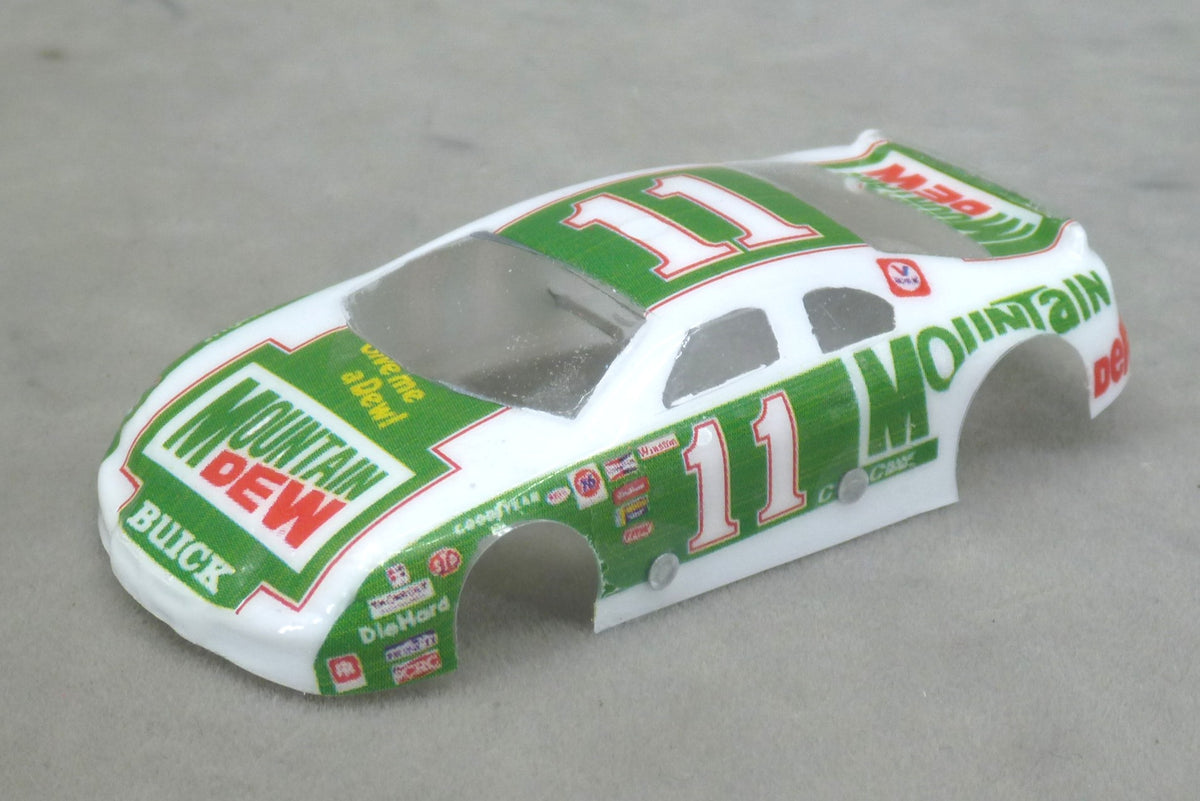 Front three-quarter view of green and white Mountain Dew #11 painted Lexan HO slot car body