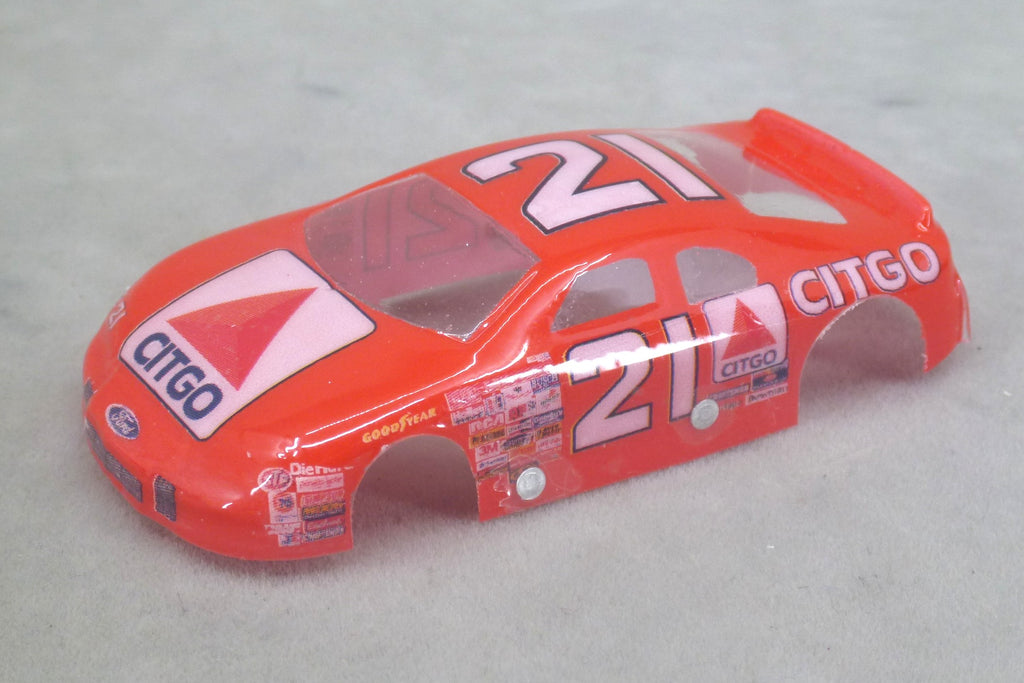 Front three-quarter view of red Citgo #21 painted Lexan HO slot car body with white number 21